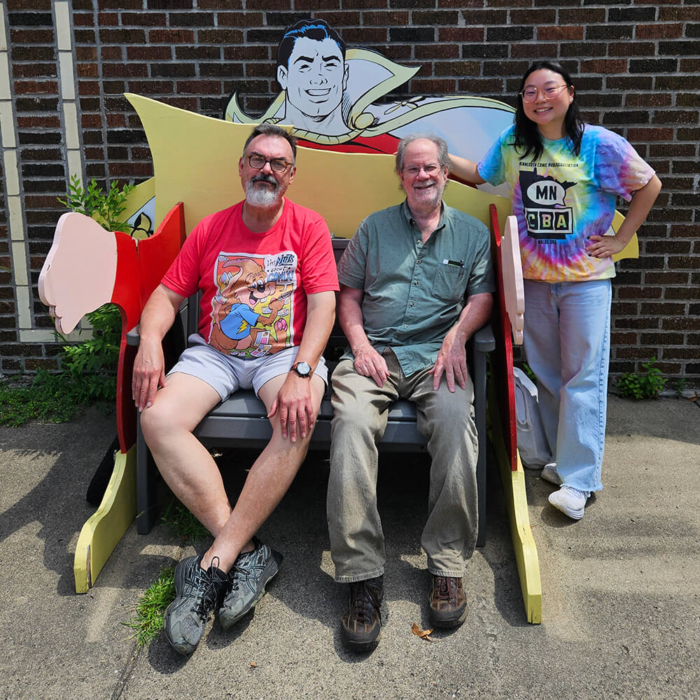 Together on the Captain Marvel bench at DreamHaven Books & Comics in Minneapolis.